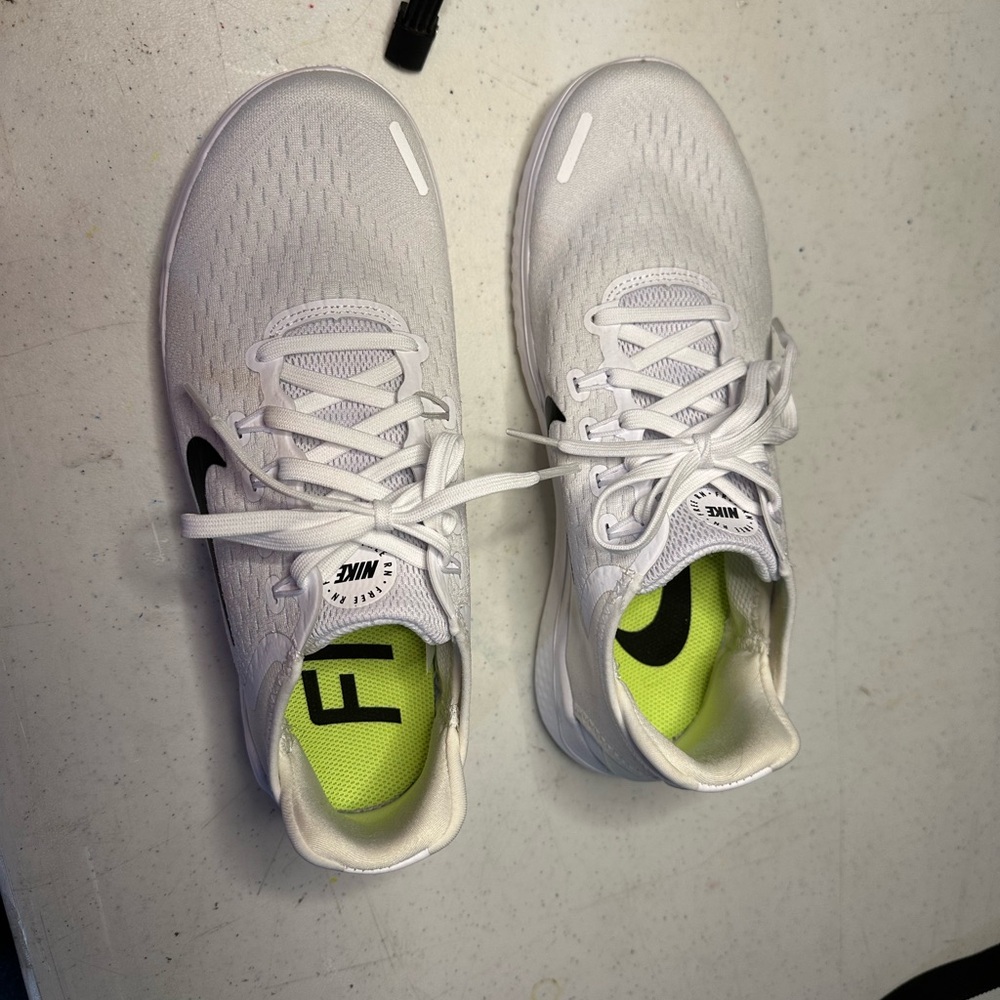 Nike White Sneakers with Neon Green Insoles and Black Swoosh